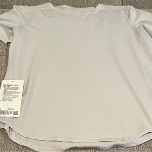 Lululemon High Neck Run and Train Tee Vapor, size 10. Like new.